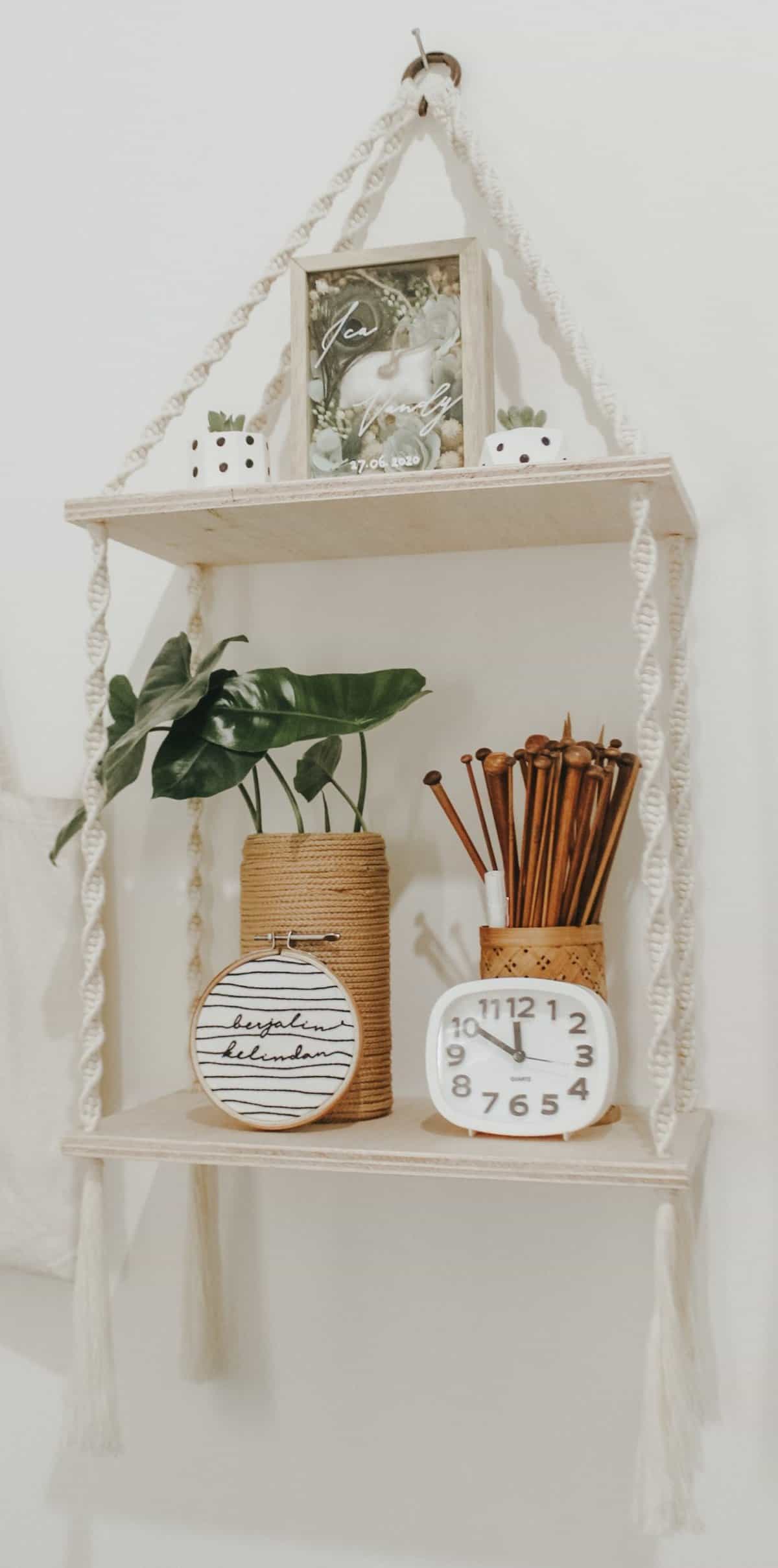 macrame hanging shelves with plant and decor