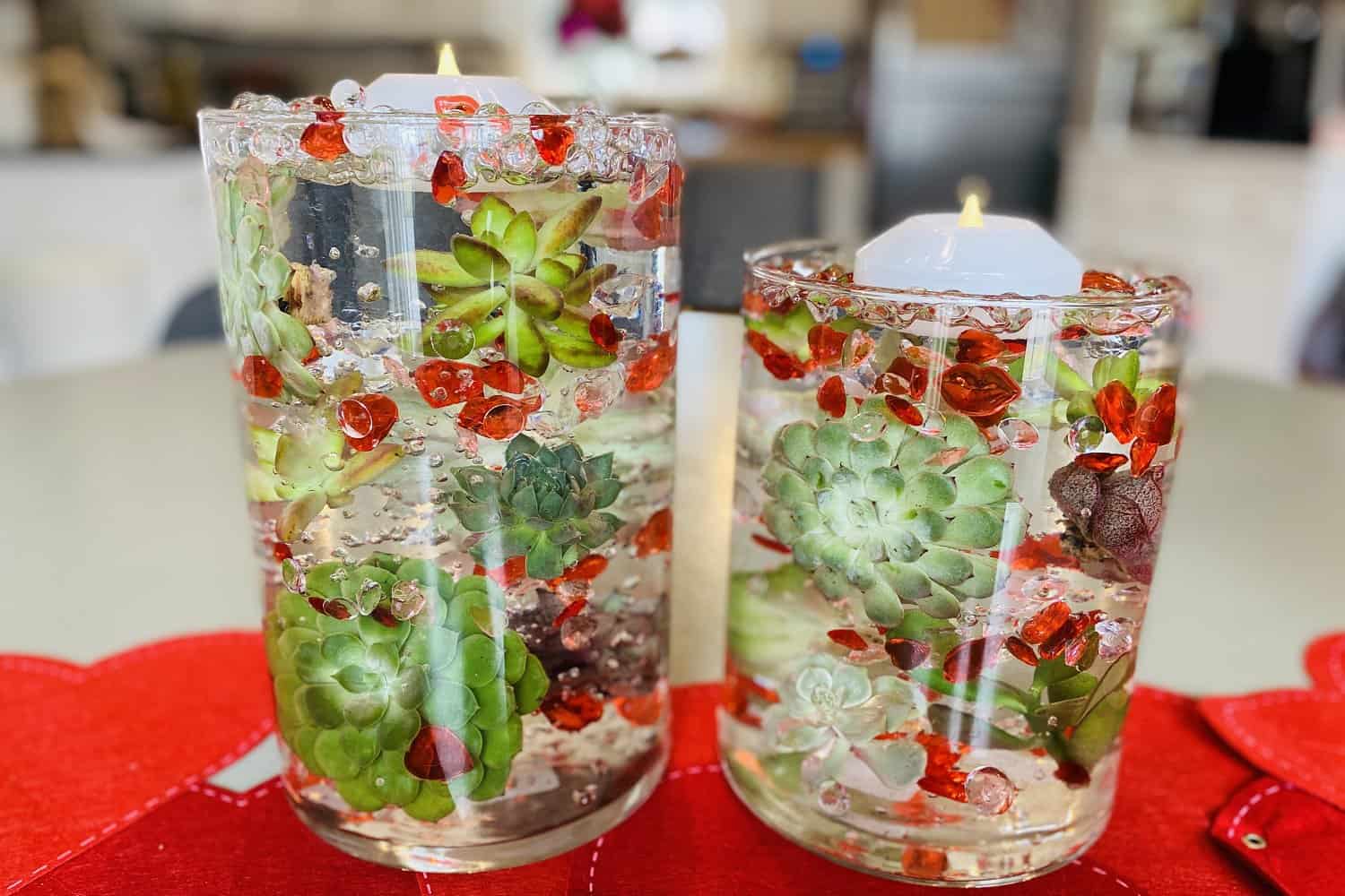two completed red succulent water bead candle centerpieces